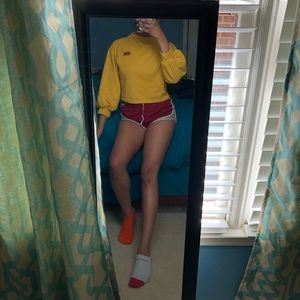A yellow puffy long sleeve shirt